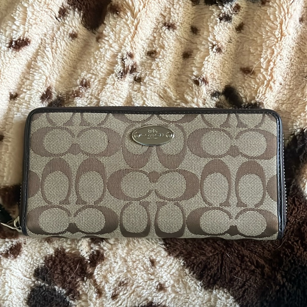 Coach clutch with pocket in back and coin compartment in middle